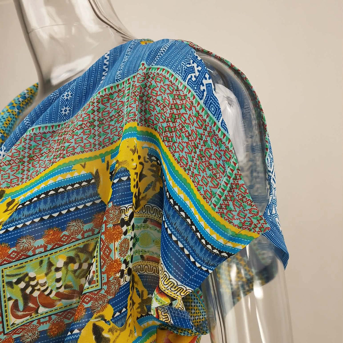 Rhapsody Print Cowl Neck with Peplum Blouse